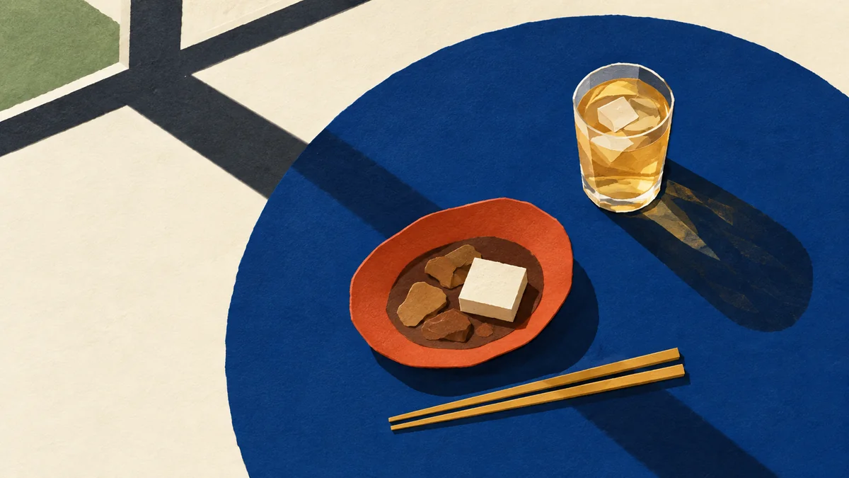 青い丸テーブルに煮込みと飲み物、長い影を描いた切り絵