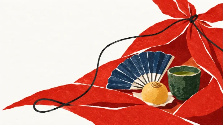 朱色の風呂敷を開き、扇子や菓子、器を配した浅草土産の切り絵